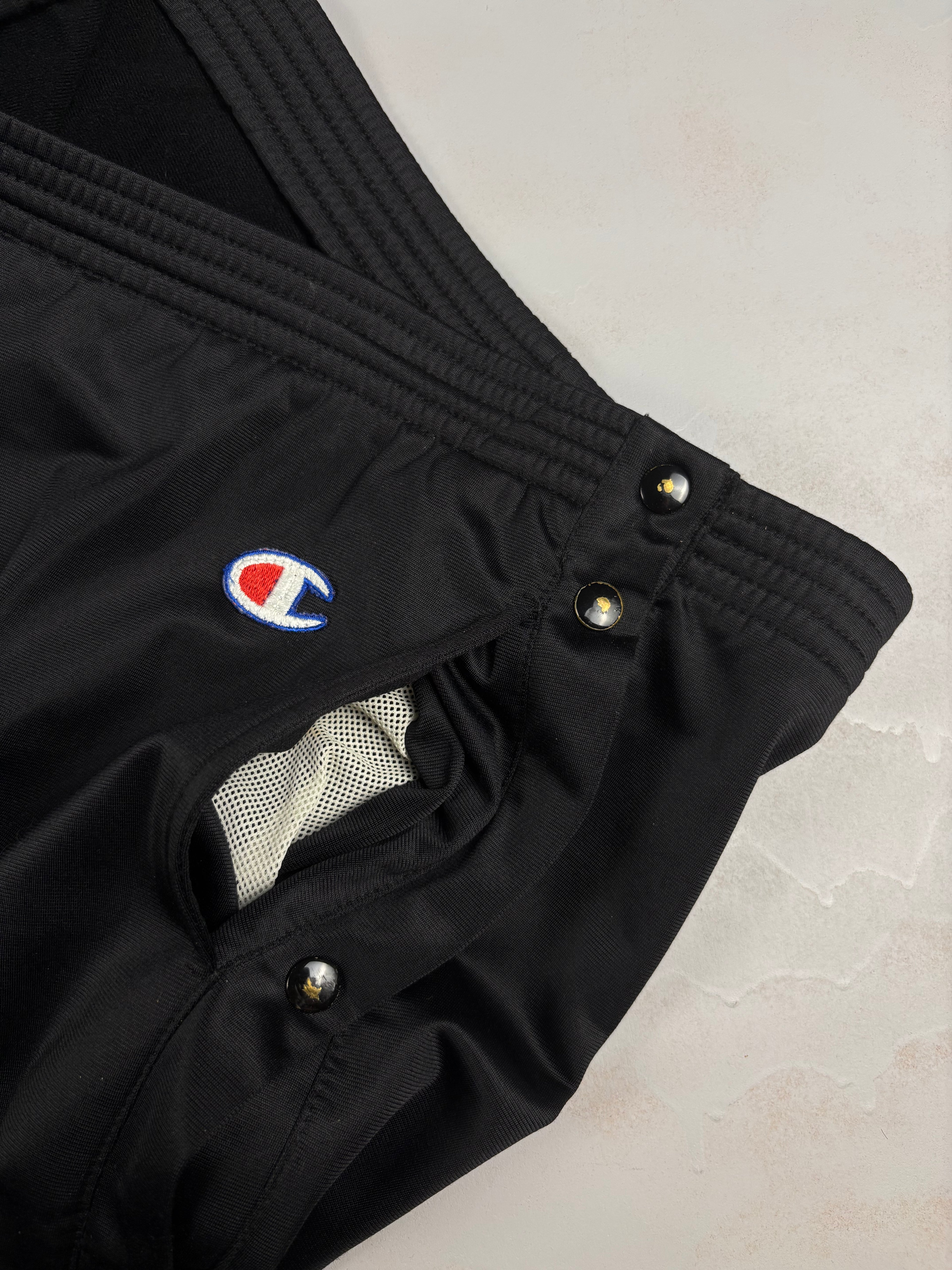 Pantaloni vintage Champion anni ‘90 con bottoni laterali