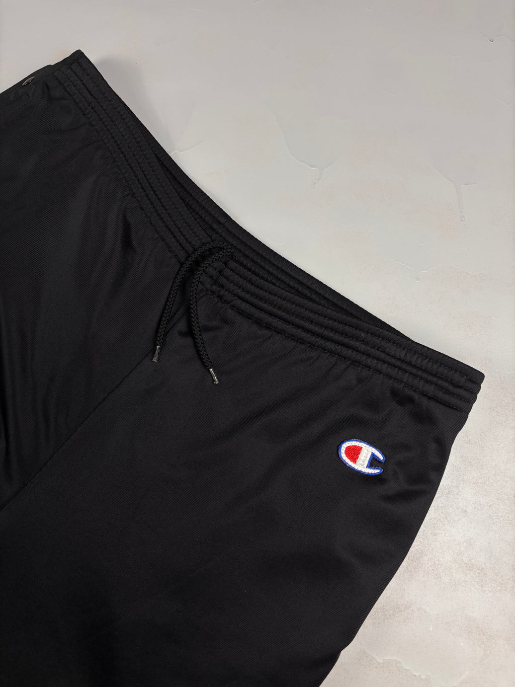Pantaloni vintage Champion anni ‘90 con bottoni laterali